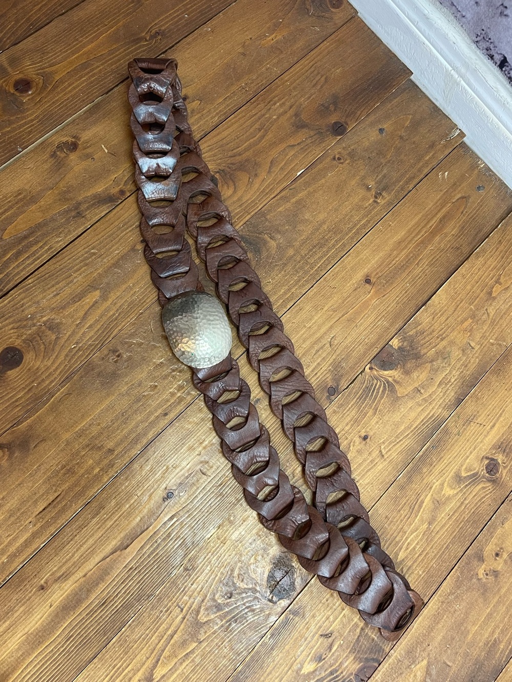 Linked leather belt with silvertone hammered buckle